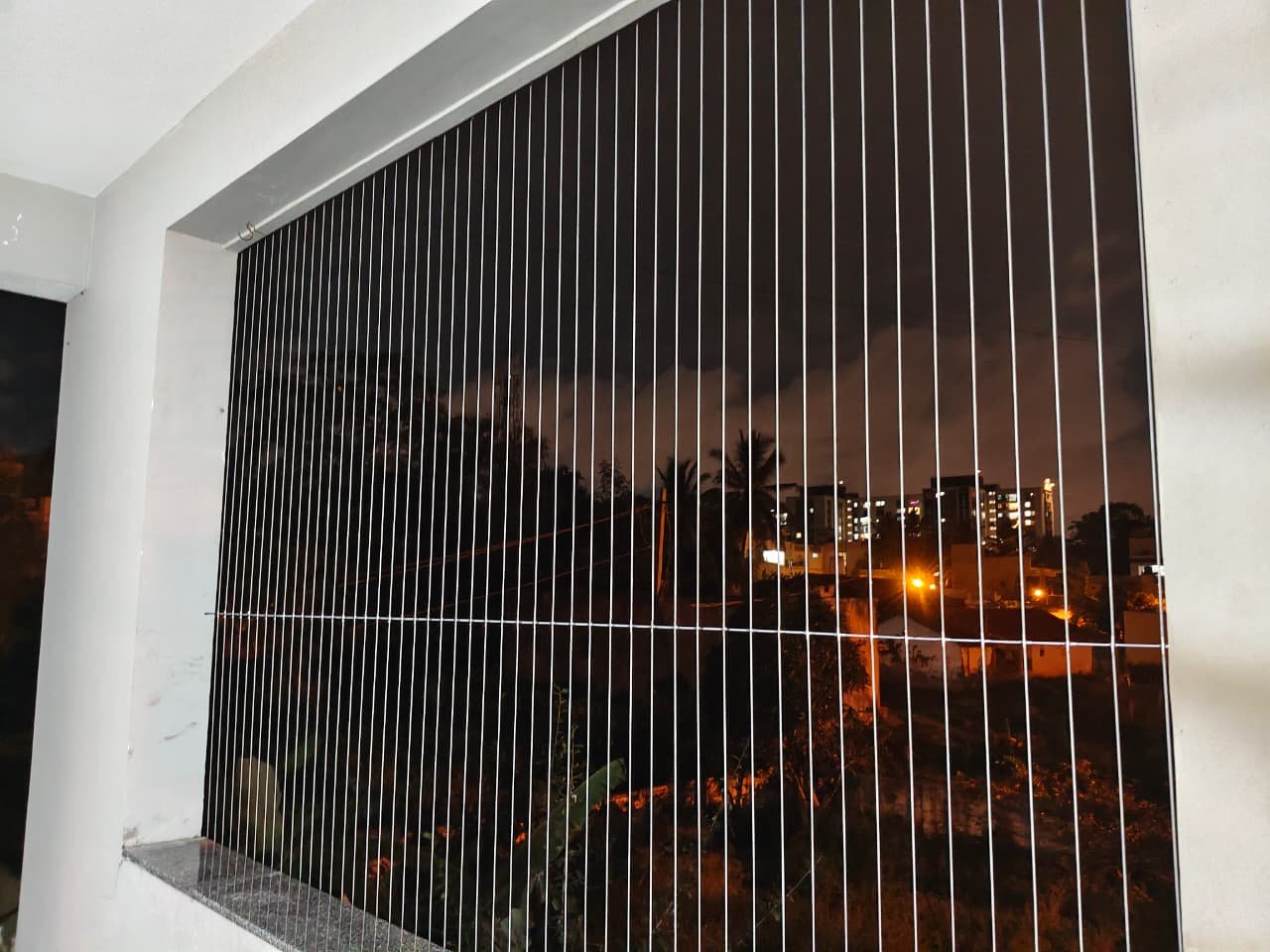 Modern balcony invisible grill installation